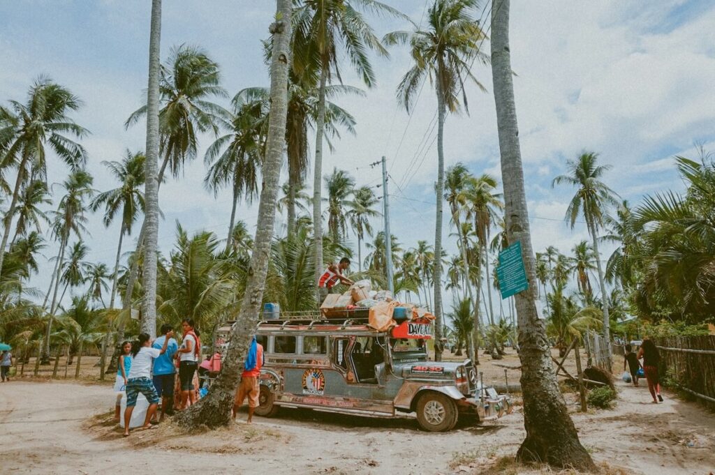 men gathered around jeepney in the Philippines