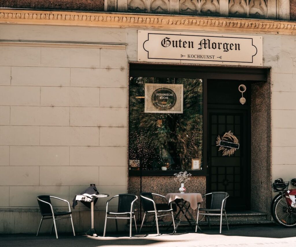 street café in Graz, Austria with outdoor seating and Guten Morgen sign