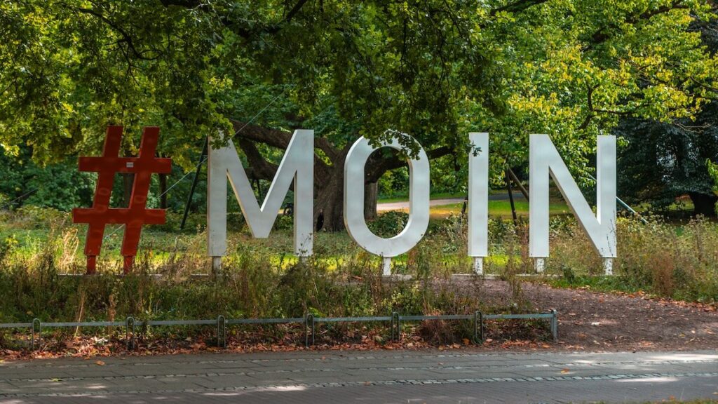Large #moin sign in a park in Bremen, Germany