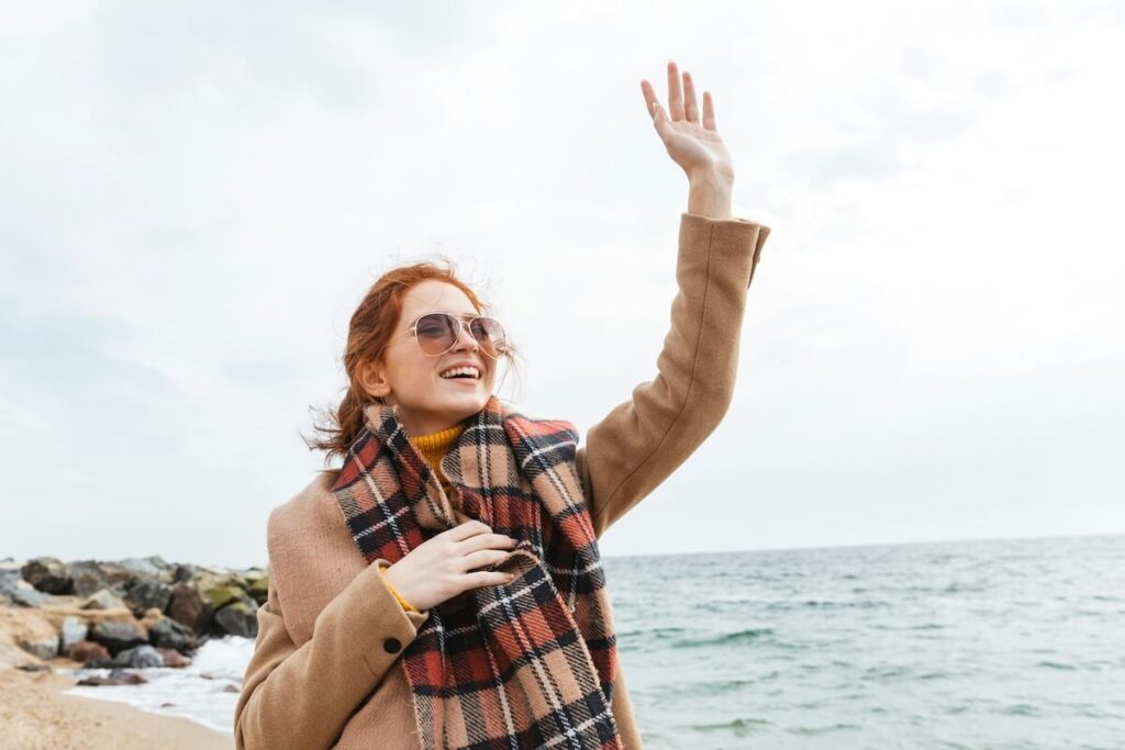 person waving goodbye