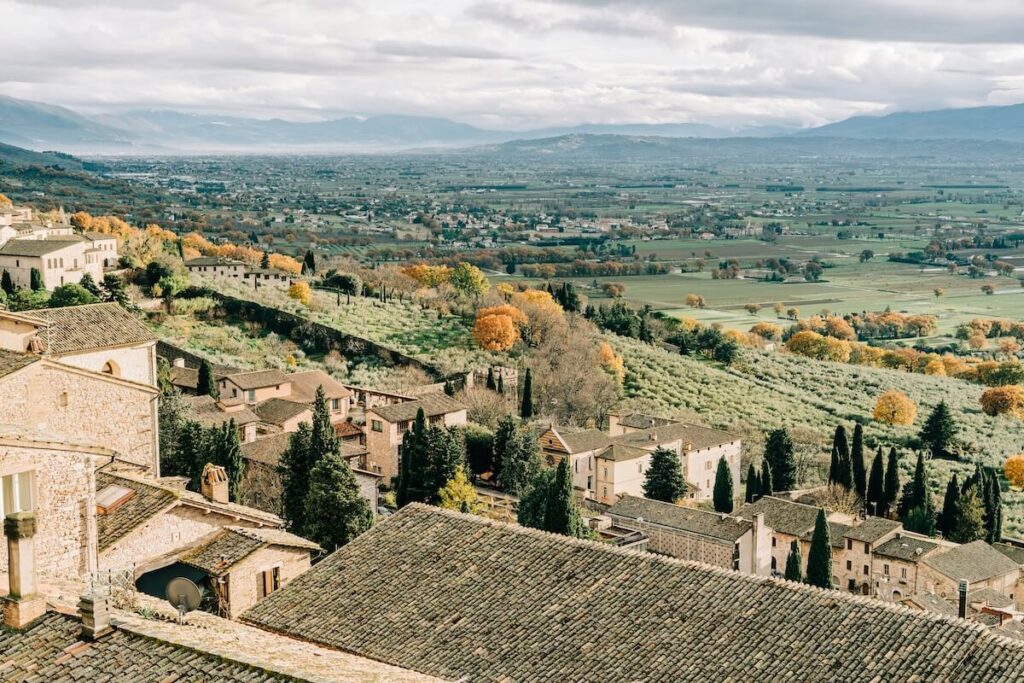 aerial view of houses and trees during daytime in Assisi, Umbria, Italy