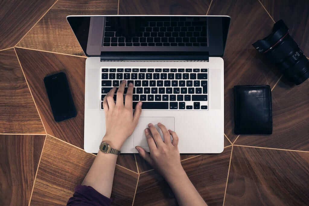 Hands on a laptop