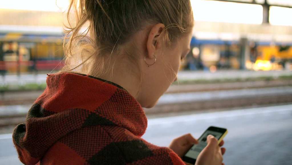 Girl using her Swedish learning app