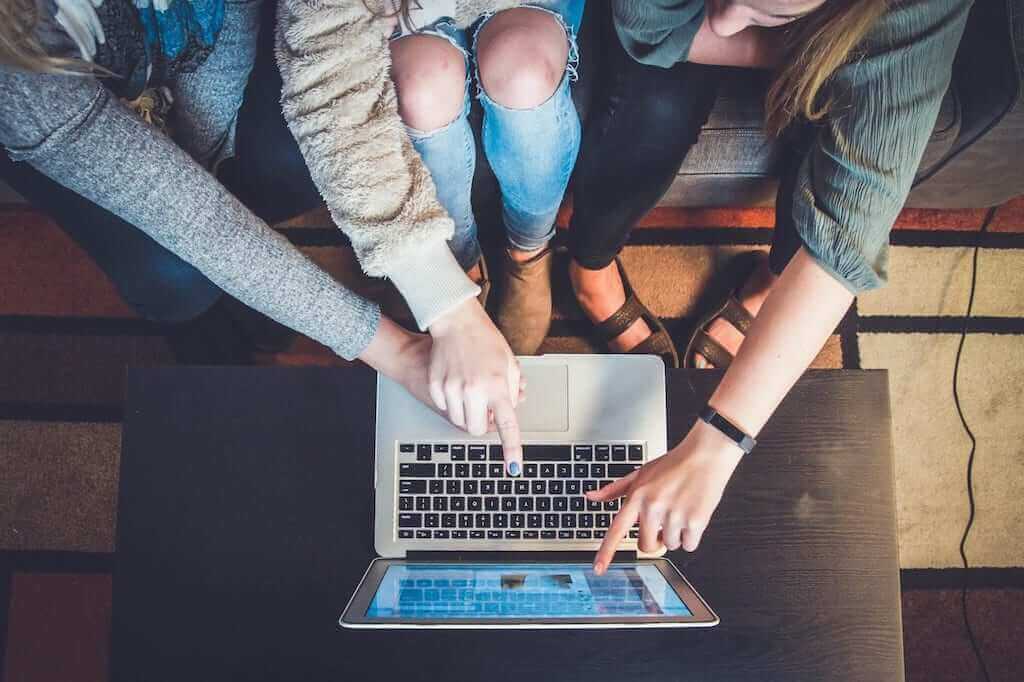 Girls learning together on laptop