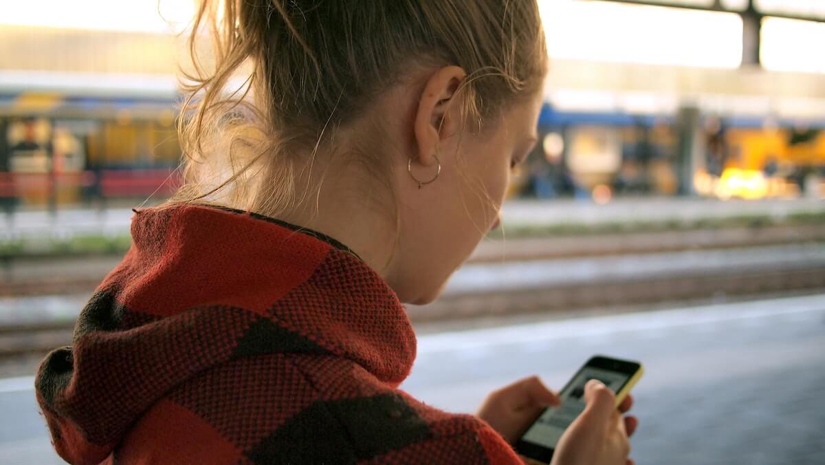 Girl using app to translate French