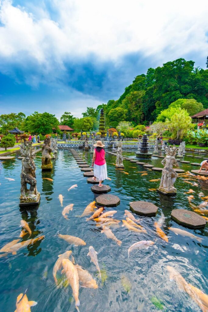 tourist at the Water Palace of Tirta Gangga in East Bali, Indonesia