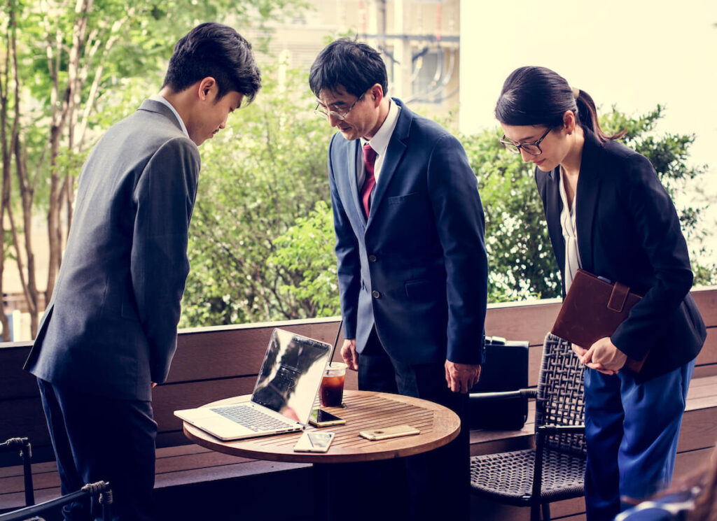 Business people bowing