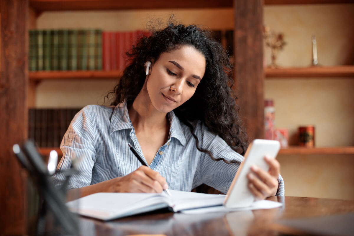 Girl study with phone and book