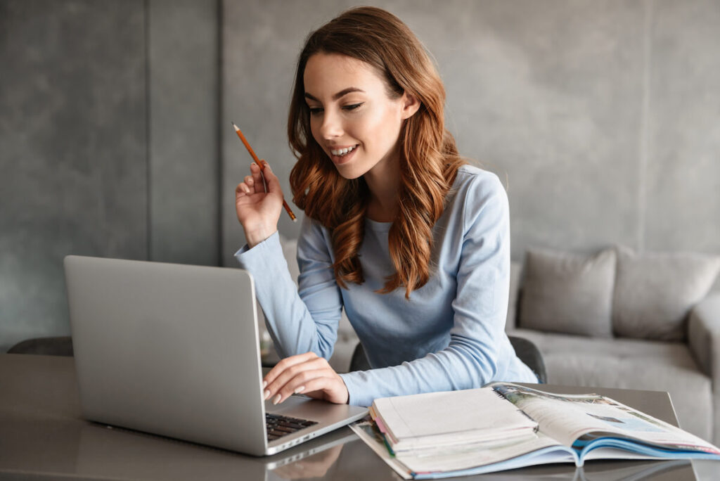 Girl smiling while enjoying her studies