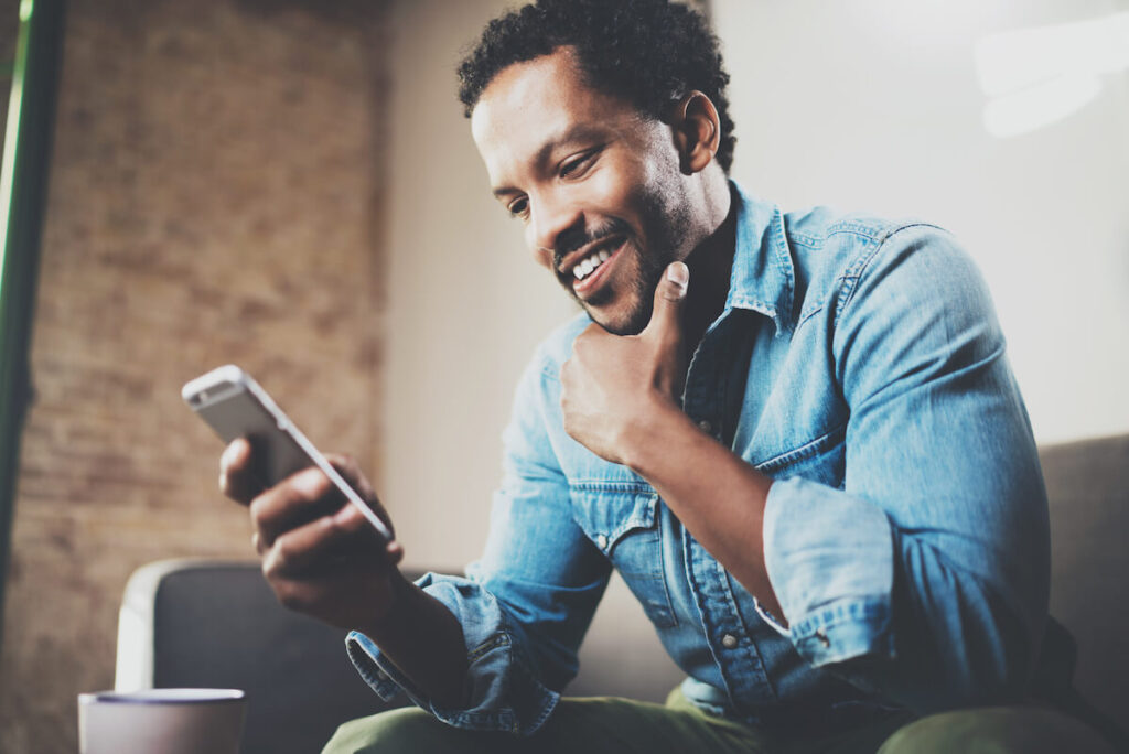 Man learning Portuguese with an app