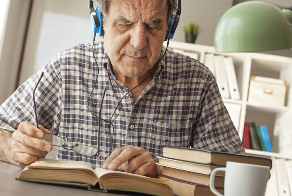 Old man reading a book