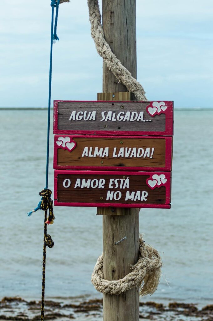 Portuguese signs at Praia de Coroa Vermelha, State of Bahia, Brazil