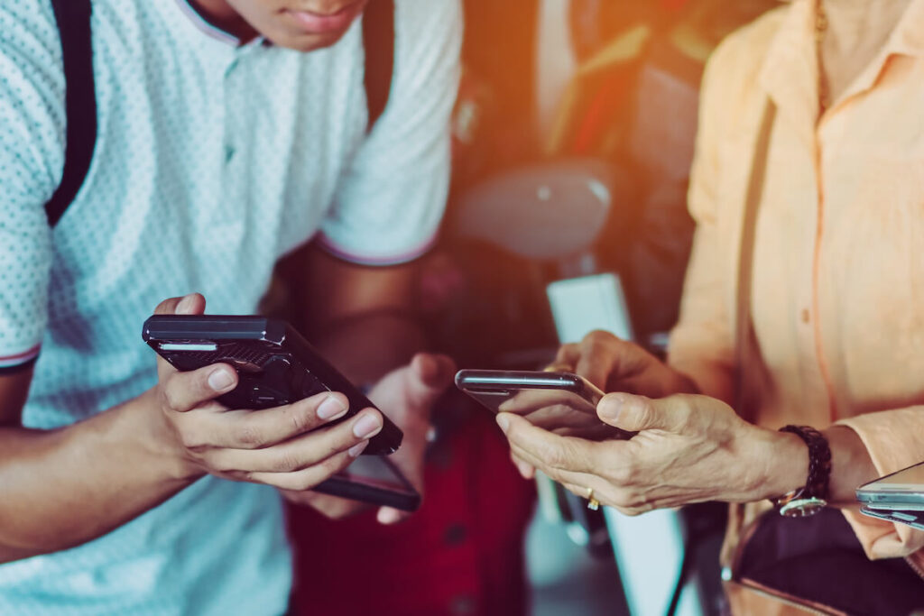 Man and woman using translator app while traveling