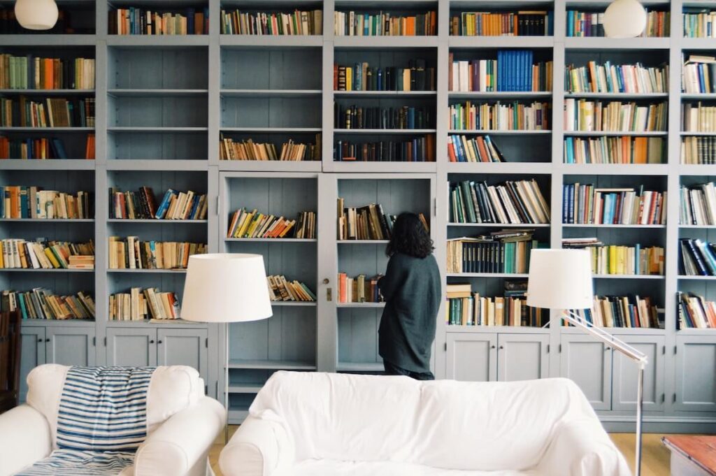 woman browsing books on shelves