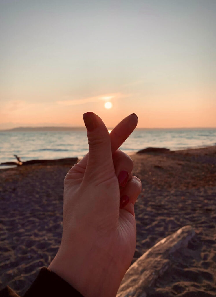 Woman doing heart finger sign