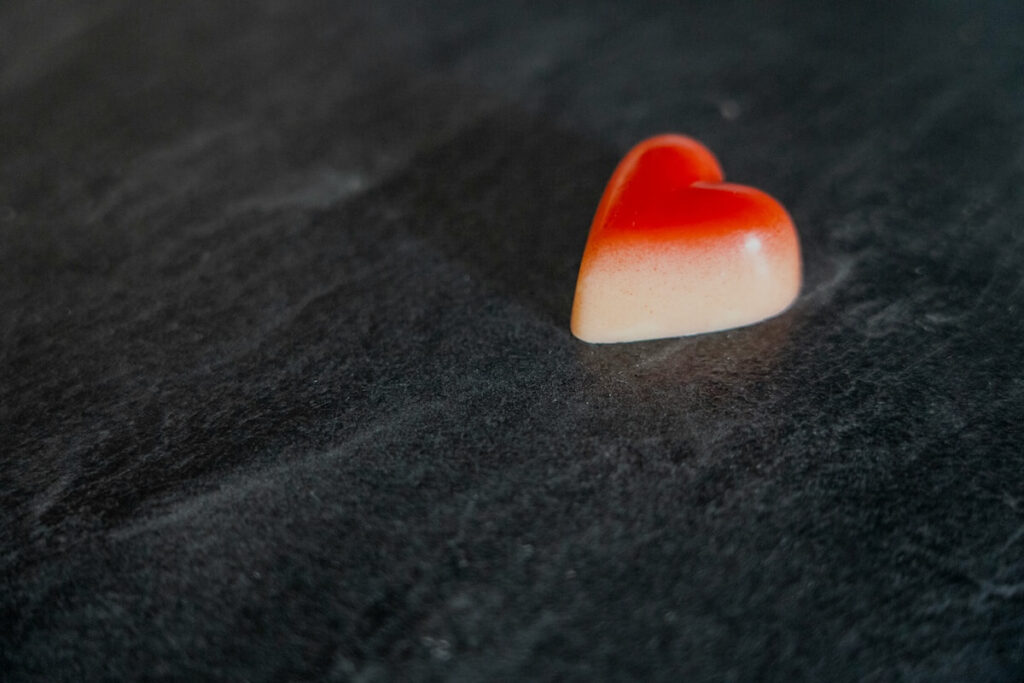 a piece of heart-shaped chocolate confection