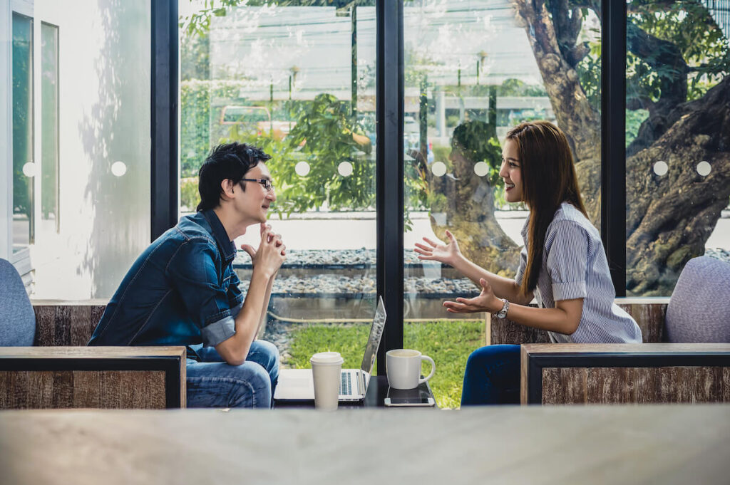 man and woman talking