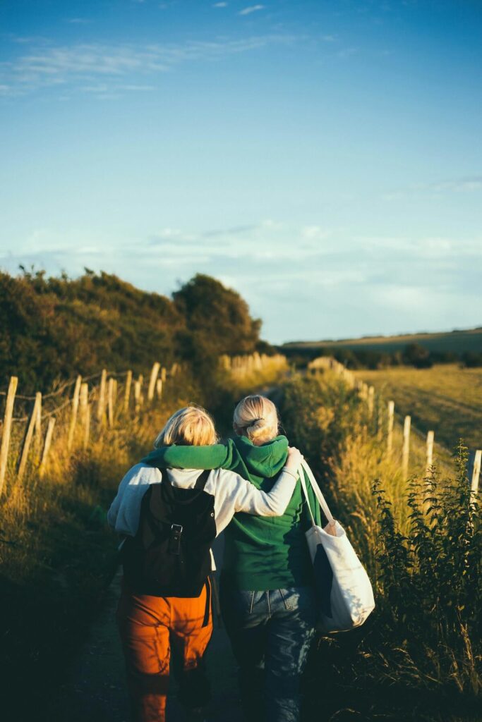 two girlfriends walking outdoors