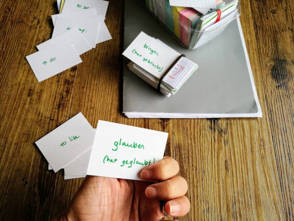 hand holding German flashcards