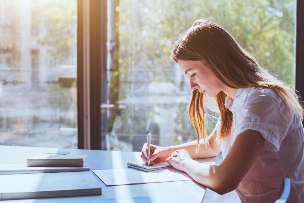 female student writing