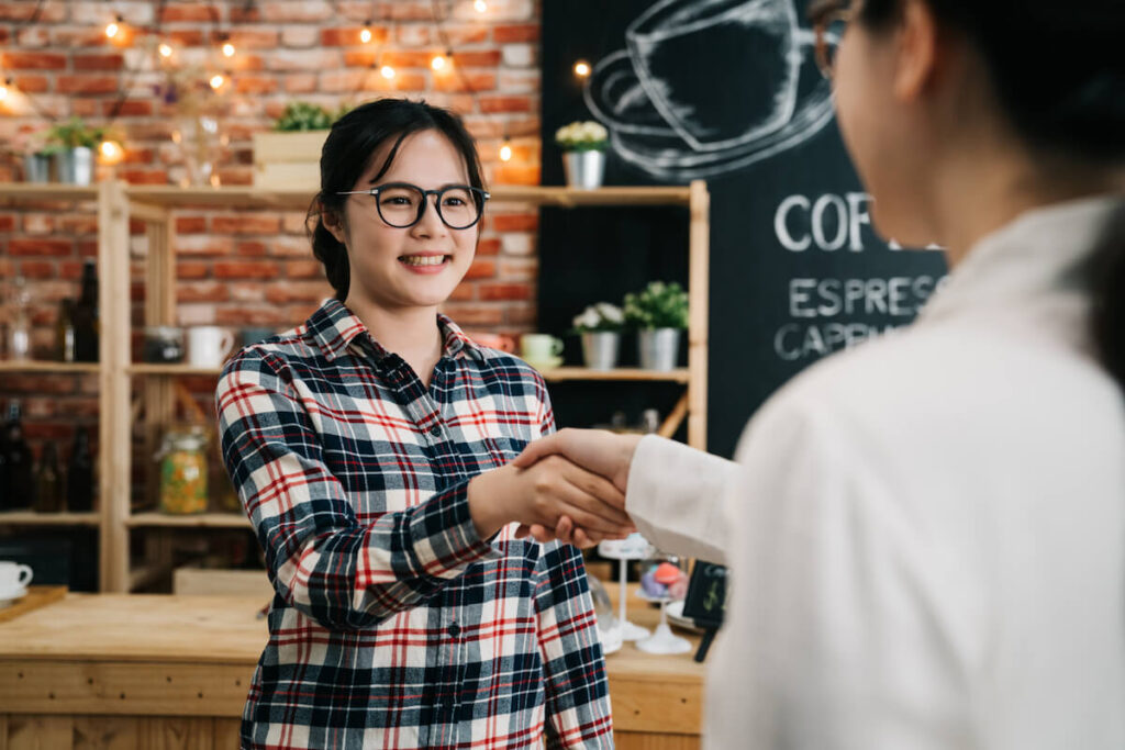 new acquaintances handshaking