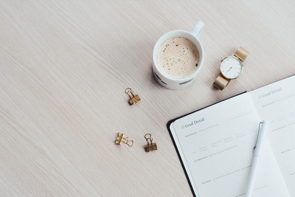 journal with goal on table
