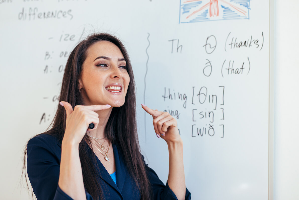 English lesson Teacher shows how to pronounce the sounds