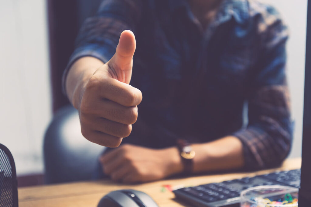 man holding thumbs up gesture