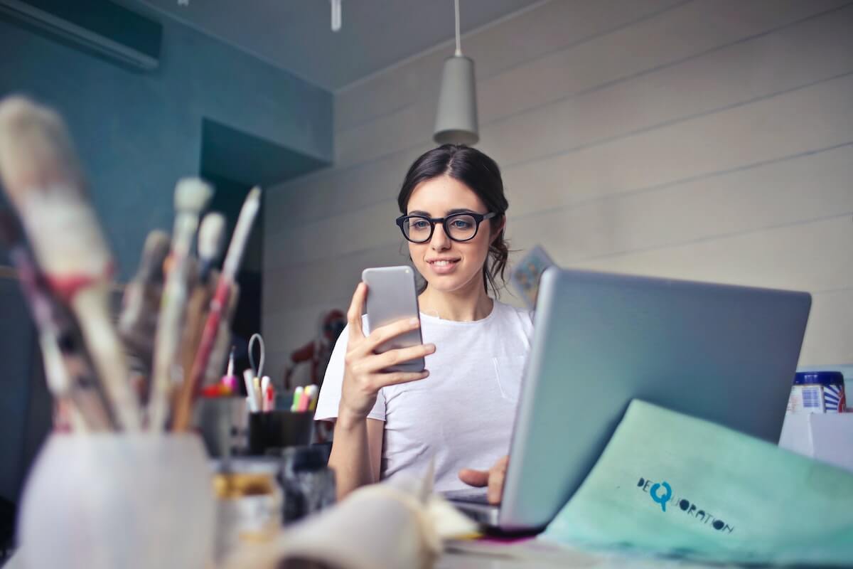 woman looking at mobile phone