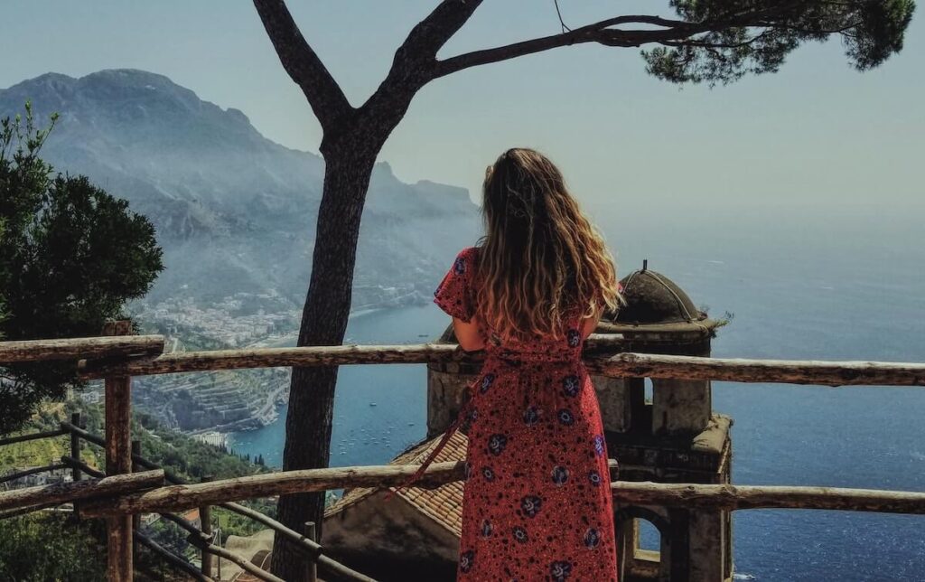 woman looking over the sea in Italy