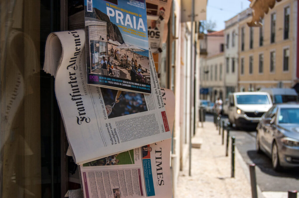 portuguese newspapers are sold on a summer street, on sunny day