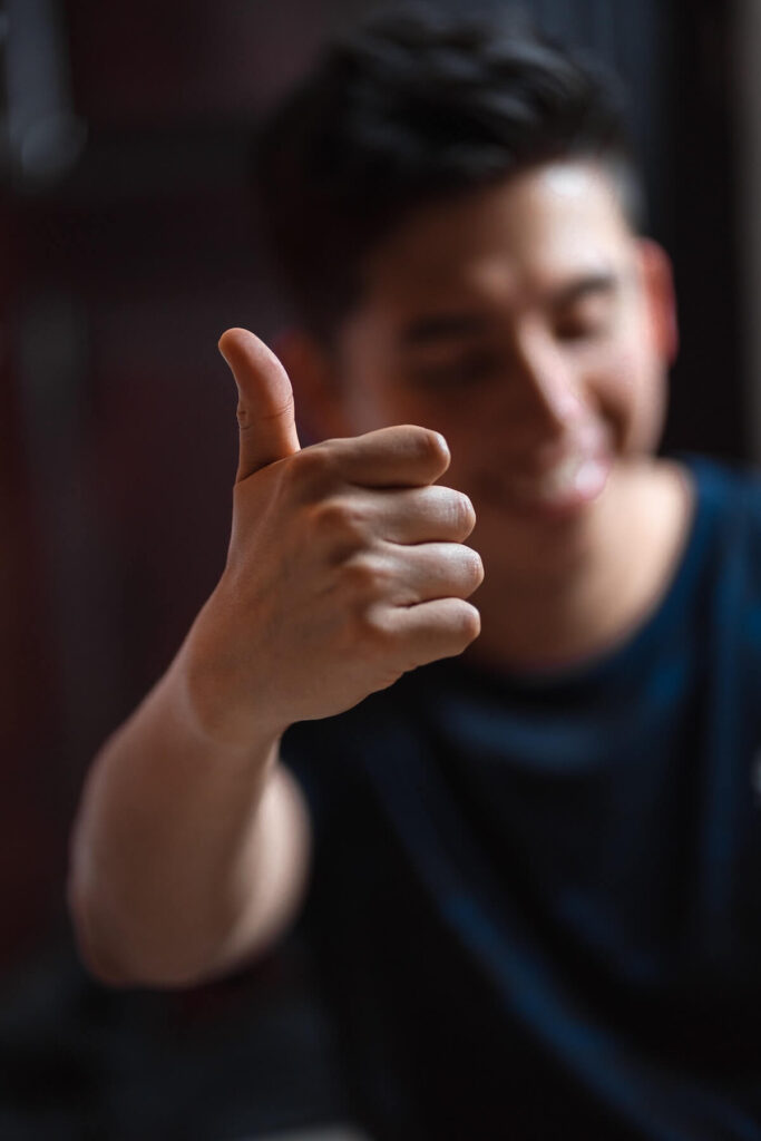 man with one thumb up