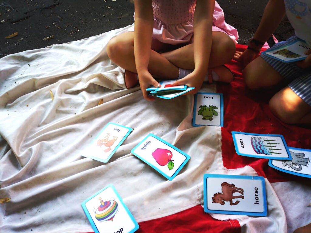 children learning from flashcards during a school activity