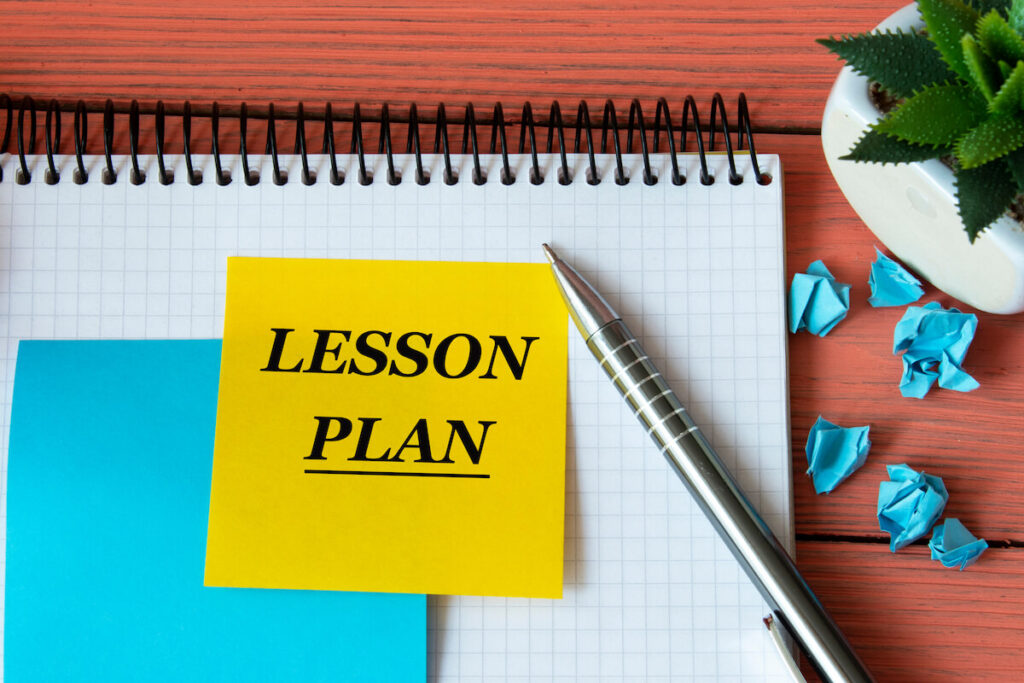 “lesson plan” on a note sheet with a cactus in the background