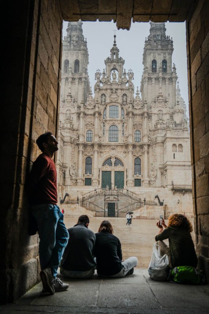 People hanging out near Santiago de Compostela Cathedral in Galicia, Spain