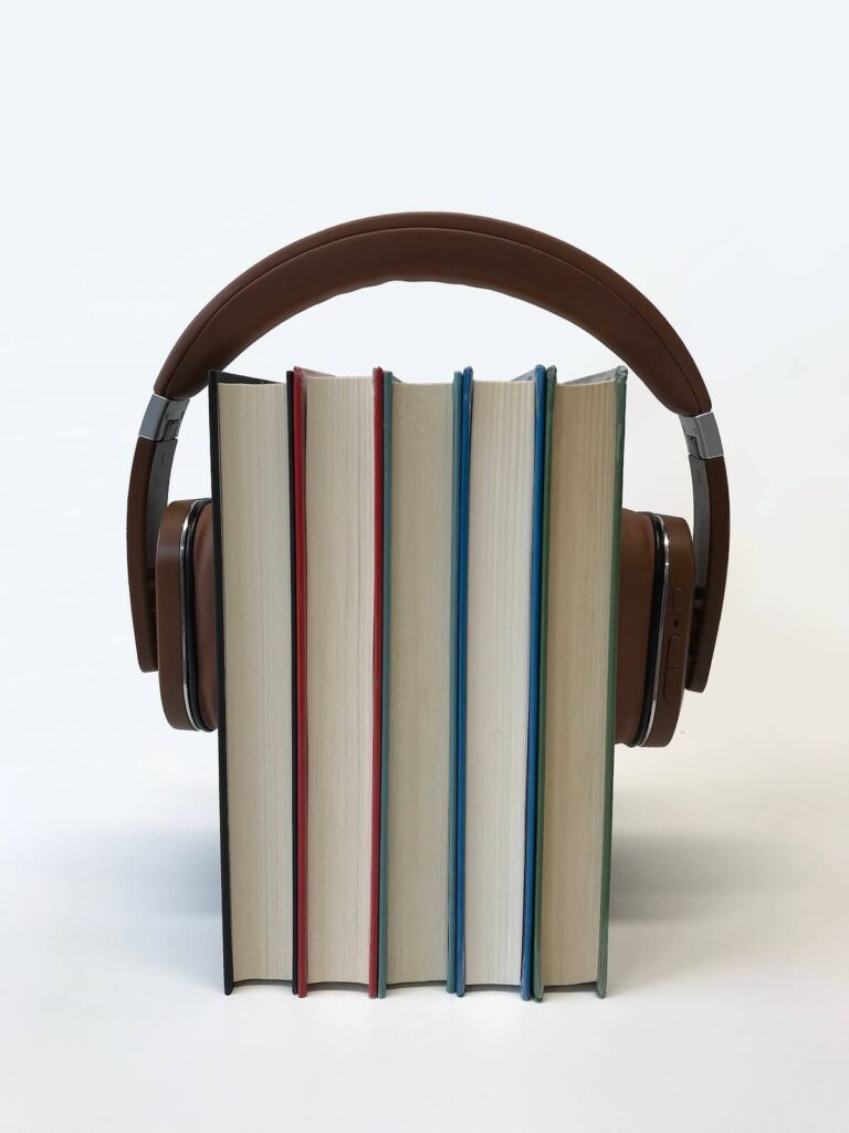 books trapped between pair of headphones