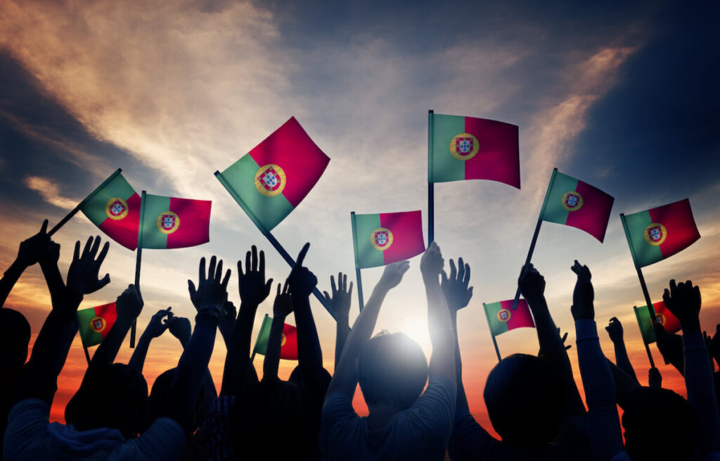 Group of People Waving Portuguese Flags