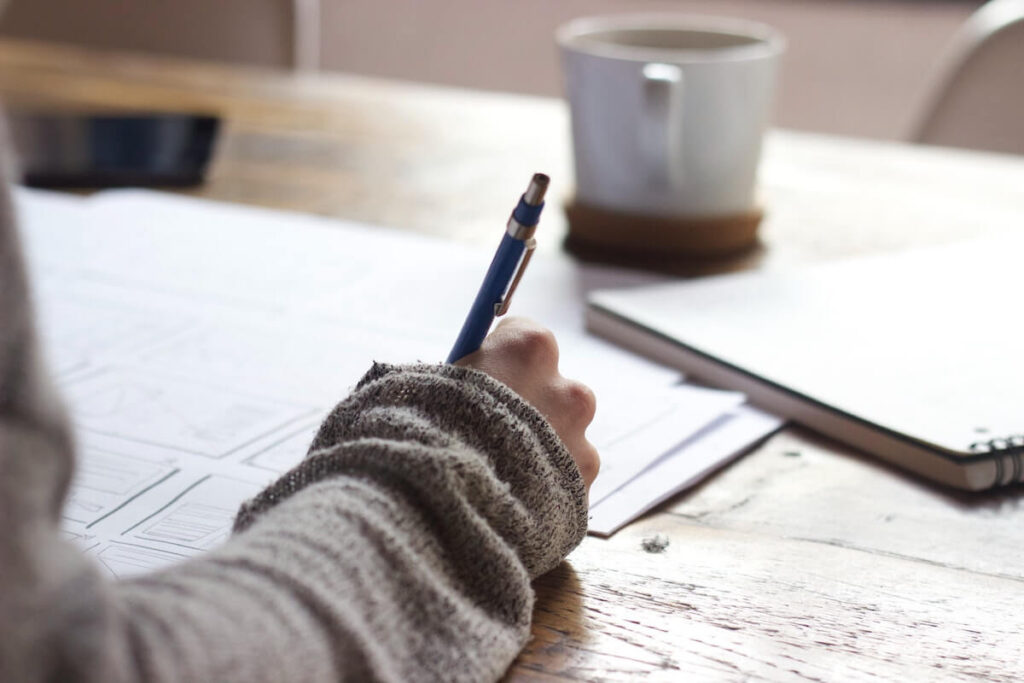 person on desk studying