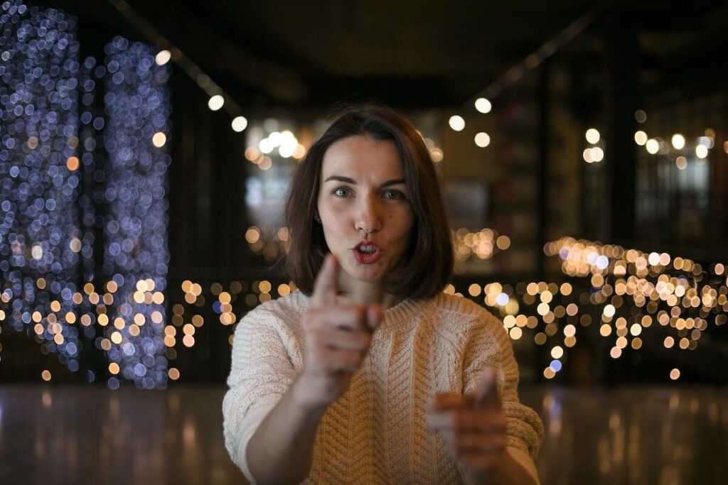 woman talks and points at screen