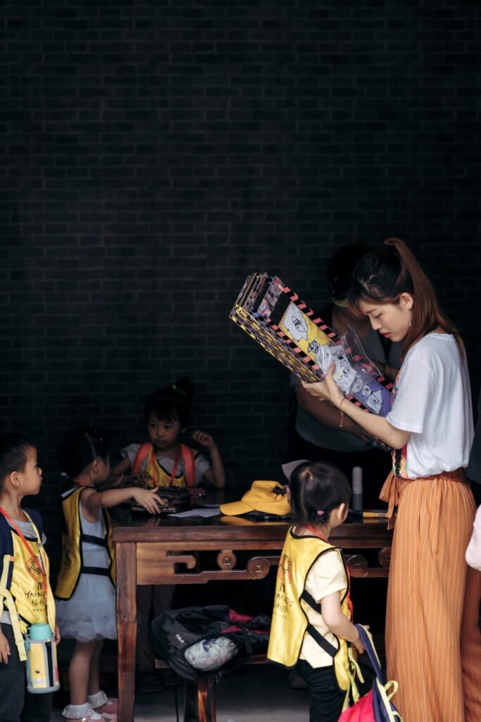 teacher and young students in a classroom