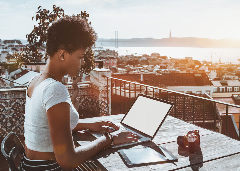 Woman studying on Lisbon rooftop