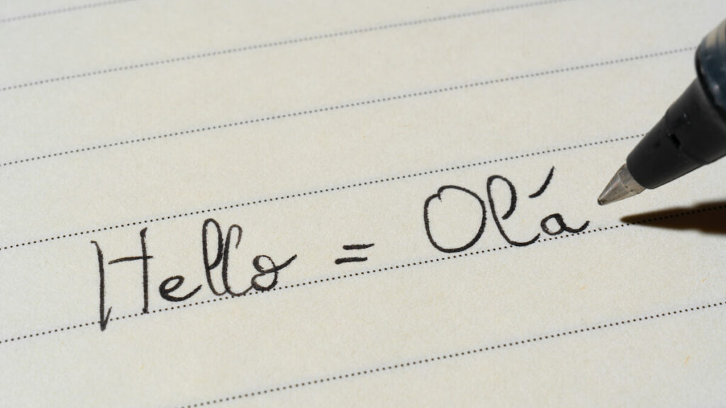 Portuguese language learner writing Hello word Ola