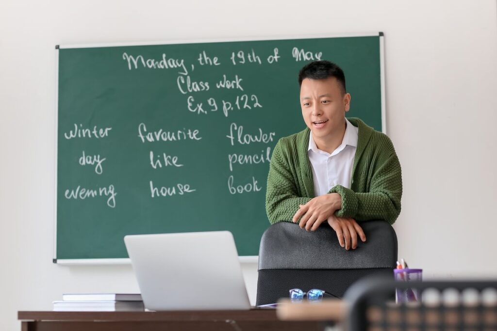 Asian teacher conducting English lesson online
