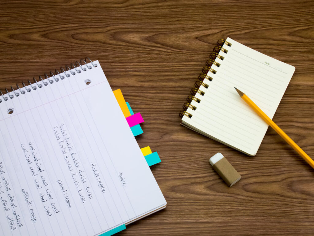Arabic words written on notebook