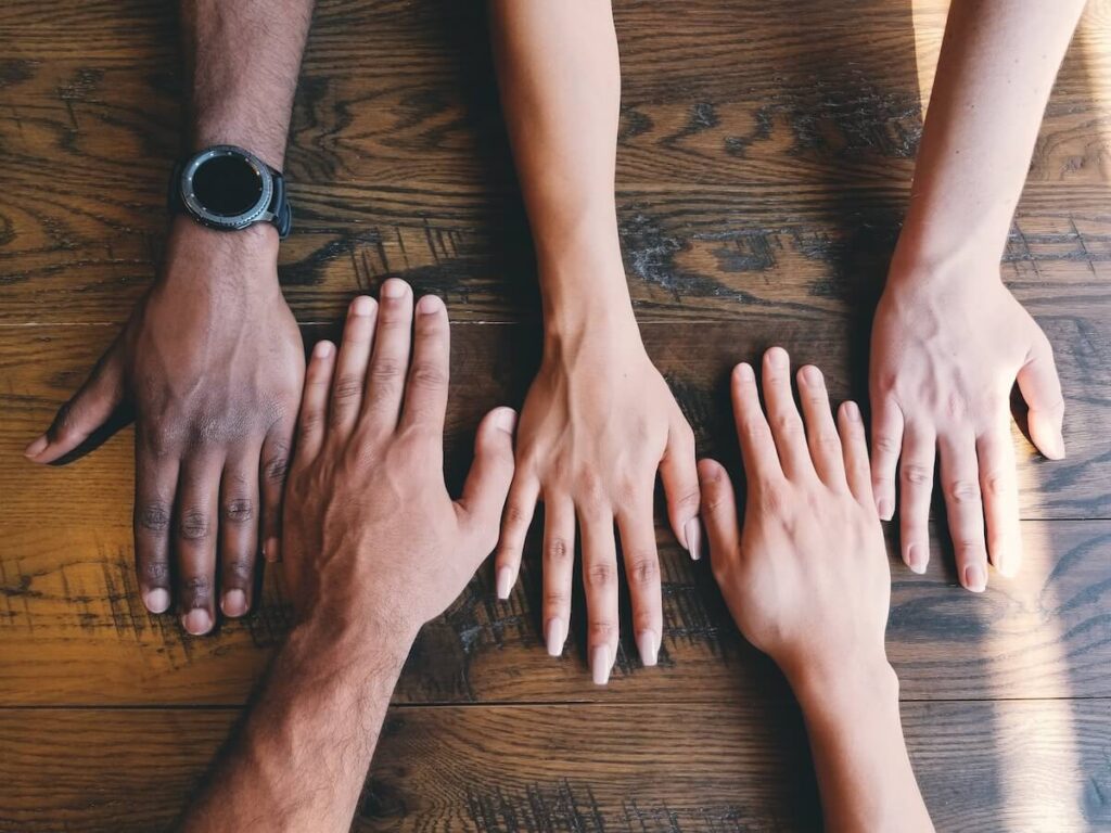 hands of people with different skin shades