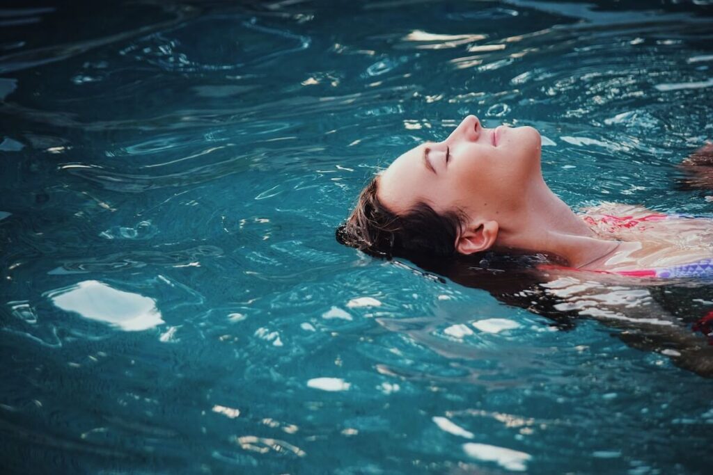woman lounging in pool