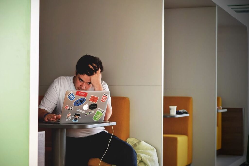 man in anxious mood using computer