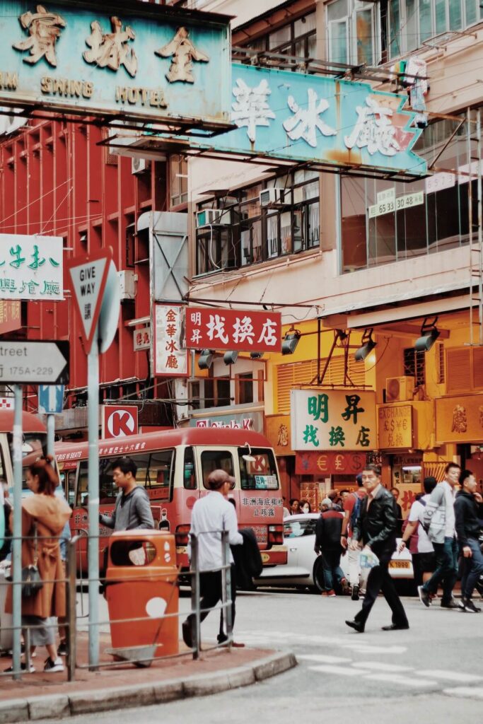 people walking on the road in Hong Kong during daytime