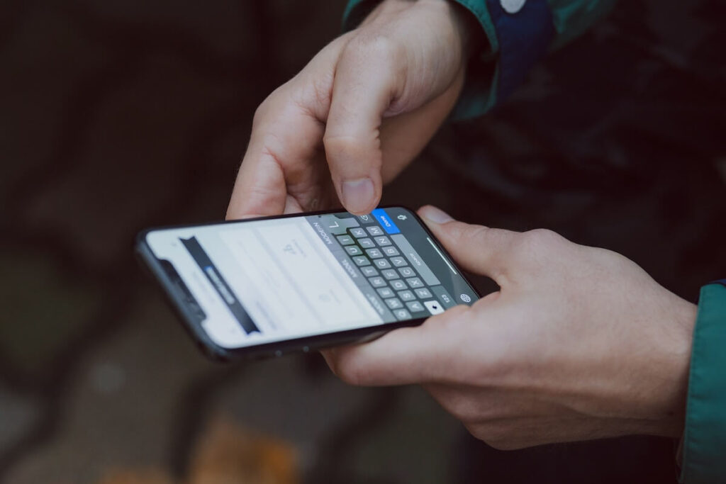 person typing on phone
