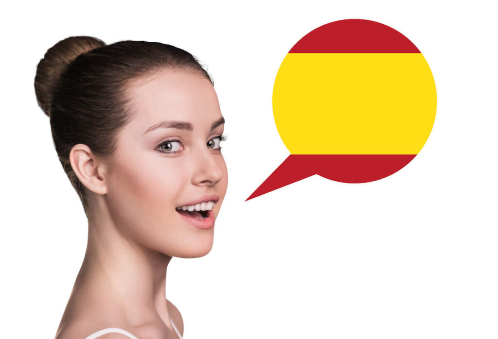 speech balloon with colors of Spain comes out of woman’s mouth